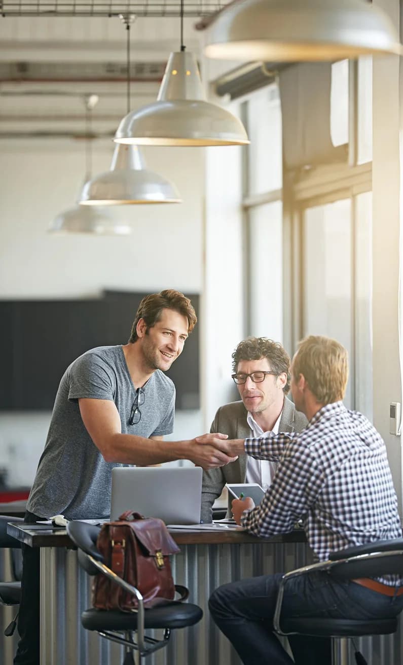 Elinext team conversation in office